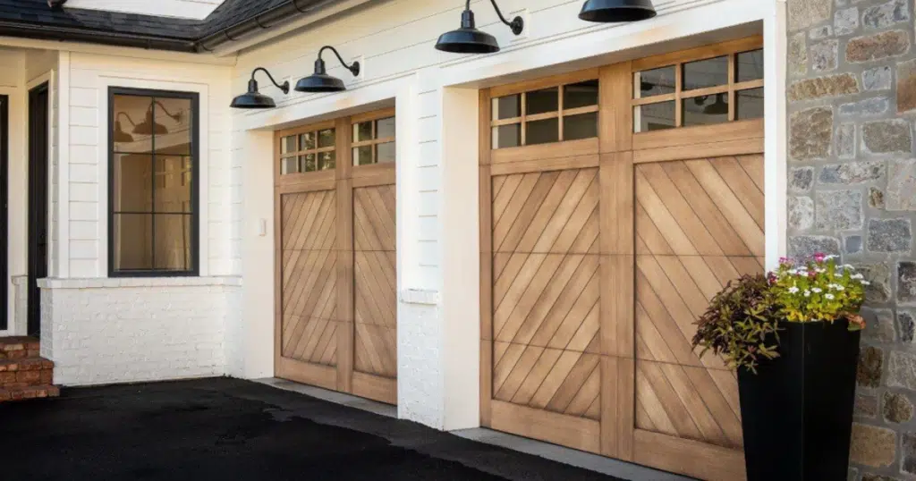 Two wooden garage doors with glass panels.